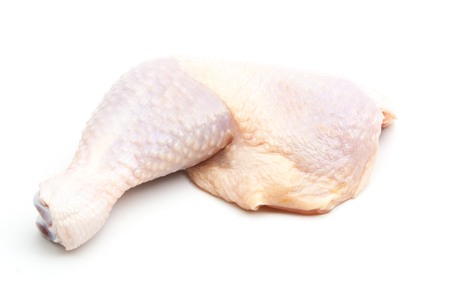 raw chicken leg isolated on white backgroundの写真素材
