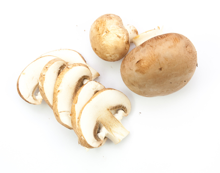 fresh champignons brown version isolated on white backgroundの写真素材