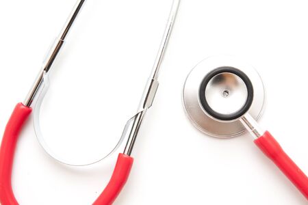 Close -up red stethoscope on white backgroundの写真素材