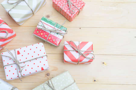 top view of various gift boxes on wooden tableの写真素材