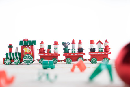 Toy train on wooden background for christmasの写真素材