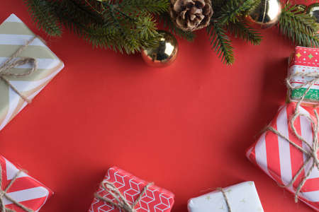 christmas gift presents in decorative boxes on red background