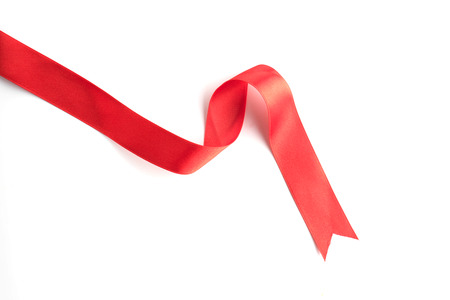 red bow ribbon satin texture isolated on white backgroundの写真素材