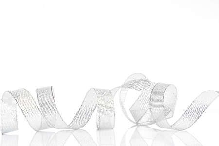 silver ribbon bow  on white isolated backgroundの写真素材