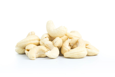 Group cashew nuts heap on white backgroundの写真素材
