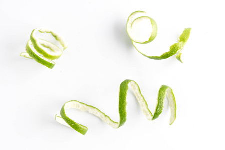 green lemon twist on white backgroundの写真素材