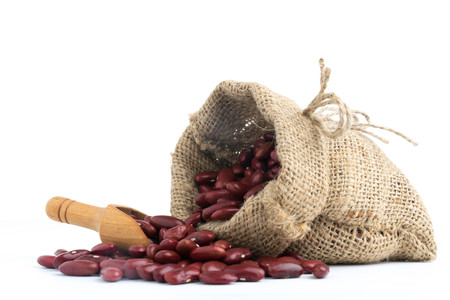 Red bean in canvas sack on white backgroundの写真素材