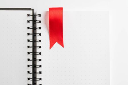 red ribbon on light bookの写真素材