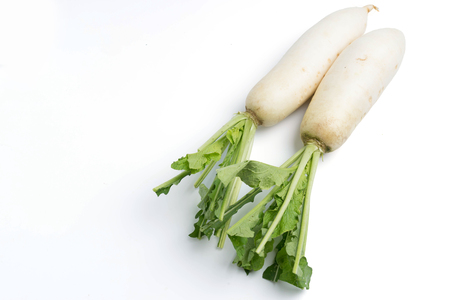 daikon radishes isolated on white backgroundの写真素材