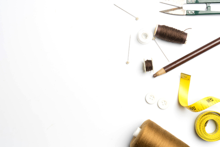 sewing supplies and accessories for needlework fabric spools on white backgroundの写真素材