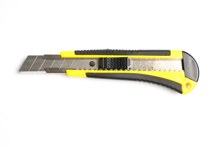Yellow paper cutter isolated on white background