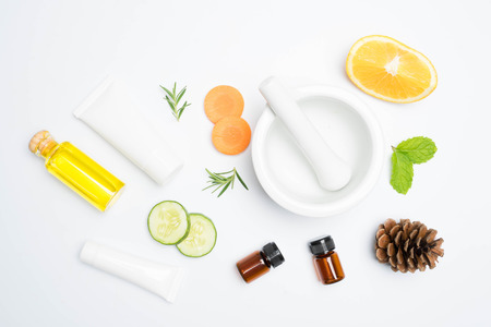 scrubs with natural ingredients rosemary oli  cucumber and leaves on white backgroundの写真素材