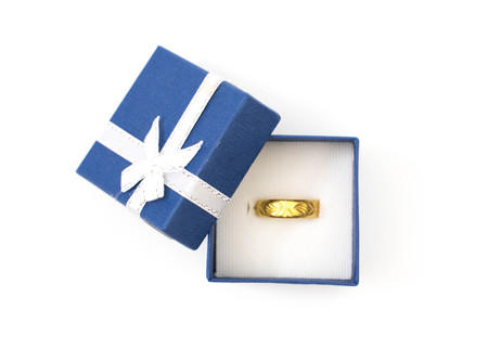 Jewelry box with gold rings on whiteの写真素材