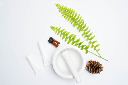 Scrubs with natural ingredients leaves on white