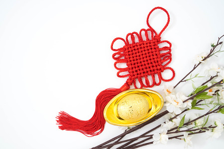 Chinese new year ornament lucky knot and plum blossom on whiteの写真素材