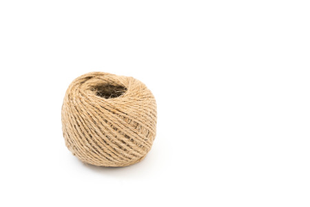 Skein of jute rope with loose end on white backgroundの写真素材