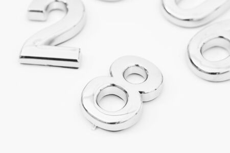 Silver scattered numbers on the table for mathematics conceptの写真素材