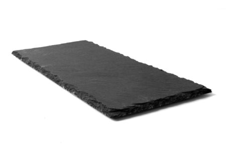 Black stone plate isolated on white backgroundの写真素材