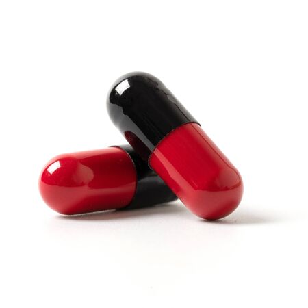 closeup pills capsules isolated white background