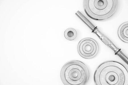 Top view of heavy weight plates space equipment isolated on whiteの写真素材