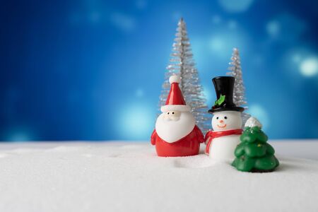 santa claus and snowman with snow backgroundの写真素材