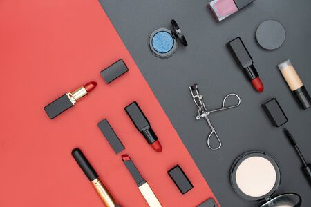 set decorative cosmetics on black and red backgroundの写真素材