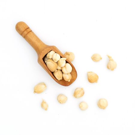 dried spices herbs siam cardamom wooden spoon on whiteの写真素材