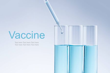 laboratory close up of a pipette dropping sample into a test tubeの写真素材