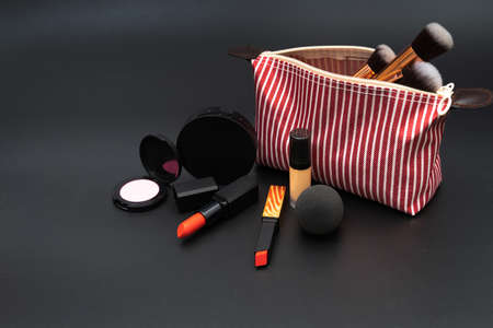 Bag set decorative cosmetics on black backgroundの写真素材