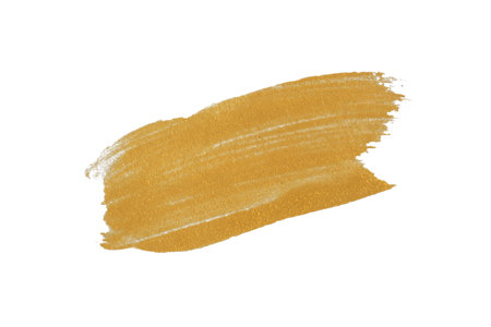 gold texture paint stain on white backgroundの写真素材
