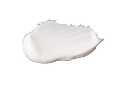white cosmetic face cream texture on white backgroundの写真素材