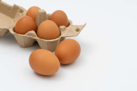 open egg box brown on yellow background