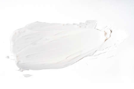 white cosmetic face cream texture on white background