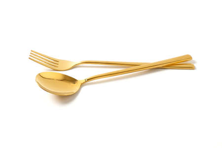 gold spoon and fork isolate on white backgroundの写真素材