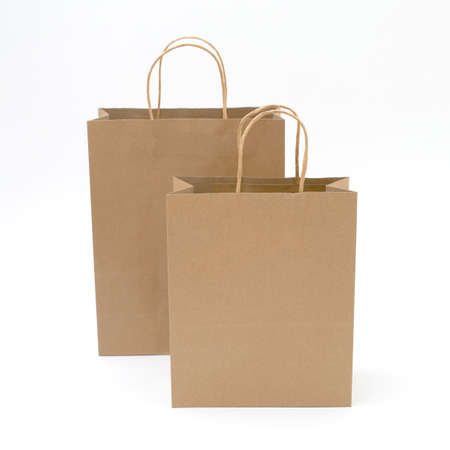 recycled paper shopping bags on white backgroundの写真素材