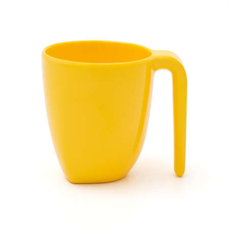 yellow mug empty on white backgroundの写真素材