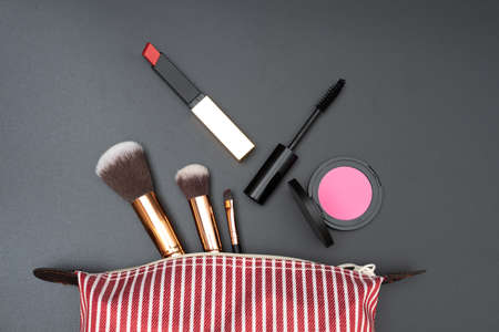 Bag set decorative cosmetics on black backgroundの写真素材