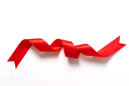 A roll red ribbon isolated on white backgroundの写真素材