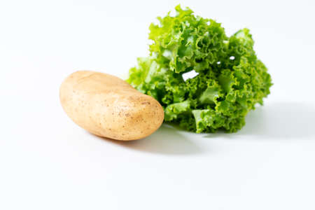 raw potatoes isolated on white backgroundの写真素材