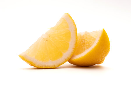 lemon fruit leaf isolate half on white backgroundの写真素材
