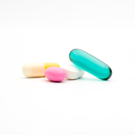 blue transparent supplement capsule isolated white backgroundの写真素材