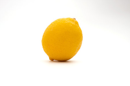 lemon fruit leaf isolate half on white backgroundの写真素材