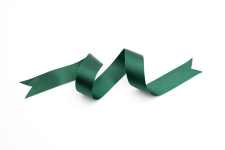 green bow ribbon satin texture on white backgroundの写真素材