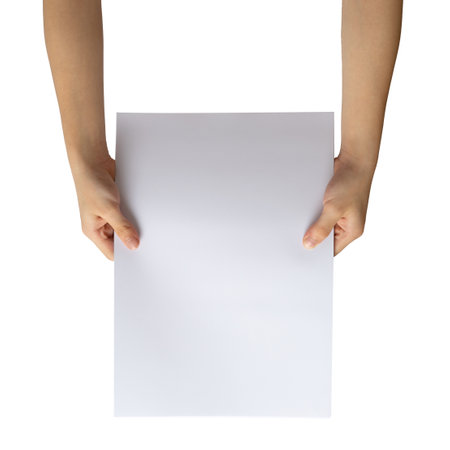 kid hands holding blank paper on white backgroundの写真素材