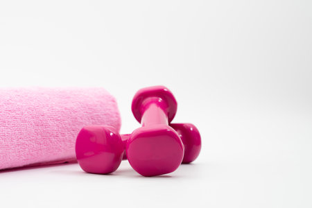 dumbells and cloth isolated on white backgroundの写真素材