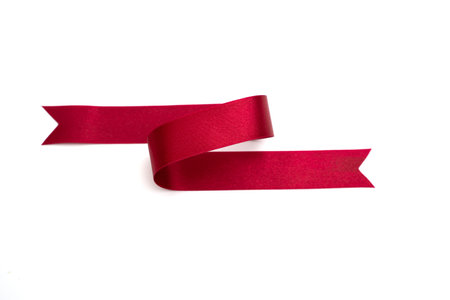 red bow ribbon satin texture on white backgroundの写真素材