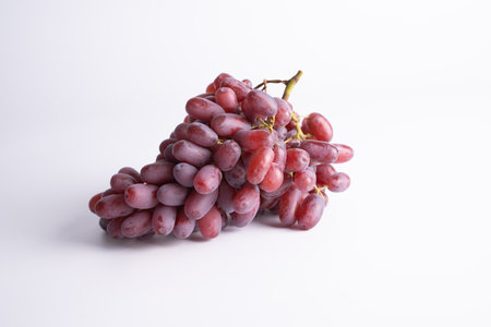 red grape big bunch on white backgroundの写真素材