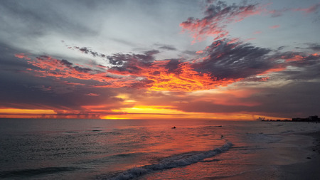 Bright Orange Sunset Beach after stormの写真素材