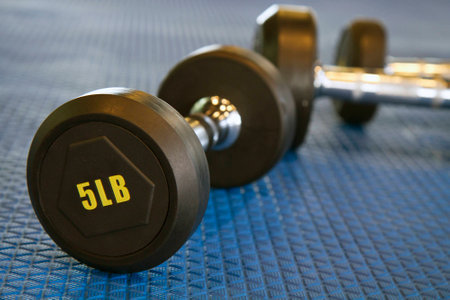 Weight lifting equipment on blue gym matの写真素材