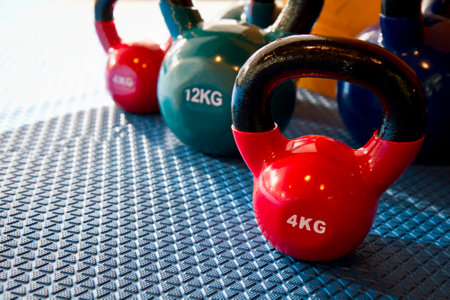 Weight lifting equipment on blue gym matの写真素材
